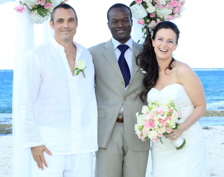 Glenn Ferguson, WPIC-certified Bahamas wedding planner and Licensed Marriage Officer, with a couple on their wedding day